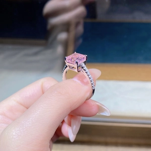 Macro shot of S925 silver ring featuring a pink rectangular carbon diamond and pavé side stones