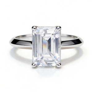 Classic 2ct emerald cut moissanite ring with 925 silver four-prong setting on white background