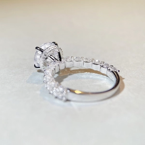 Macro detail of 3 carat moissanite ring with halo setting and four-claw craftsmanship