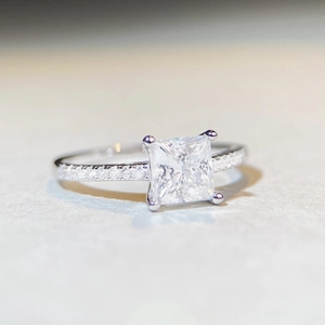 Elegant 925 sterling silver ring with square princess cut moissanite and side stones