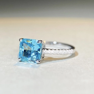 Macro view of S925 silver ring featuring square aquamarine zircon and prong setting
