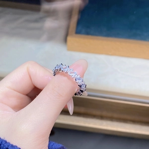 Detailed close-up of zigzag pave-set cubic zirconia ring in 925 sterling silver band