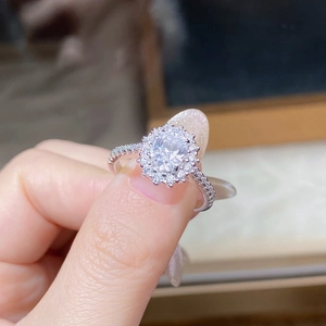 Macro shot of S925 sterling silver ring with oval moissanite and micro-pave diamonds
