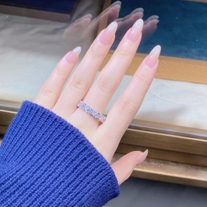 Close-up of S925 silver ring with rectangle cut cubic zirconia stones worn on finger