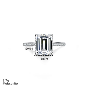 Detailed macro view of 4 carat emerald cut moissanite ring with 10x8mm stone dimensions
