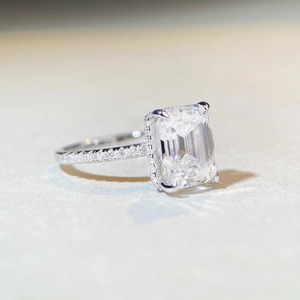 Classic 925 silver emerald cut moissanite ring with shimmering side stones in white gold