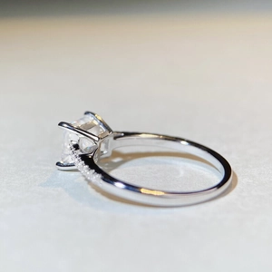 Macro shot of 925 silver moissanite ring with a square-cut diamond and 4-claw setting