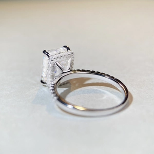 925 silver 4ct emerald-cut moissanite ring with halo design and pave band side view