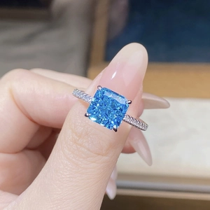 Detailed shot of S925 sterling silver ring with blue square-cut zircon and pave setting
