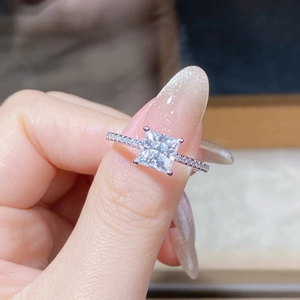 Macro shot of 925 silver ring featuring a square moissanite in a four-prong setting