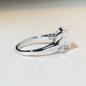 Classic 4 carat emerald cut moissanite ring with side stones in 925 sterling silver