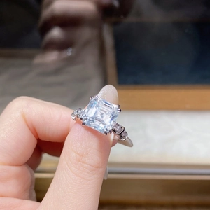 Macro shot of the Asscher cut moissanite ring with shimmering side stones in s925 silver