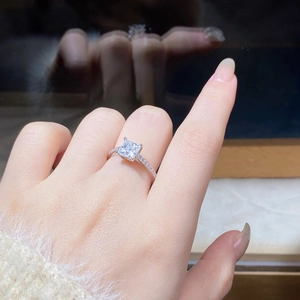 Macro shot of 925 silver ring featuring a 6x6mm square moissanite with four-claw setting