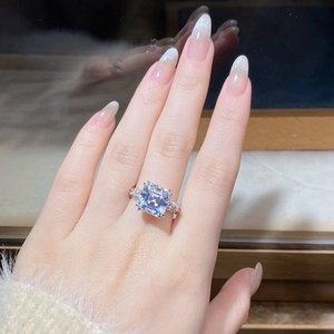 Macro shot of 5 carat Asscher cut moissanite ring in S925 silver on a finger