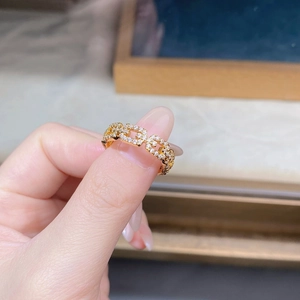 Close-up of gold chain ring with sparkling pave cubic zirconia crystals on hand