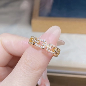Close-up of a gold S925 sterling silver chain ring set with sparkling zircon stones