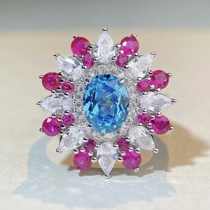 Bague de luxe en argent 925 avec pierre bleue ovale et accents floraux en zircon rose