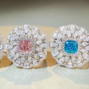 Sparkling S925 sterling silver flower rings with pink and blue cushion-cut ice zircons