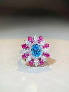 Macro detail of high-quality 925 silver ring featuring a large oval blue gemstone and zircon