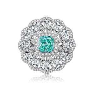 Elegant S925 silver sunflower ring with green gemstone center and halo diamond detailing