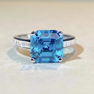 S925 sterling silver ring with large Asscher cut blue gemstone and side baguette diamonds