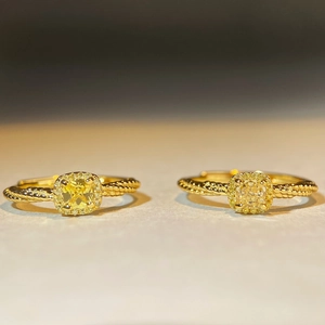 Two sterling silver sugar cube yellow diamond rings with twisted gold rope bands