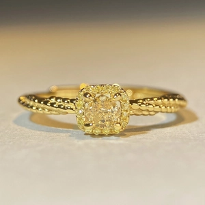 Square yellow gemstone ring with halo diamonds and gold twisted rope band detail