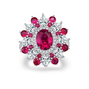 Elegant 925 silver flower ring featuring central red oval gemstone and zircon accents