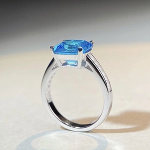 S925 sterling silver ring featuring a large emerald-cut light blue gemstone and accents