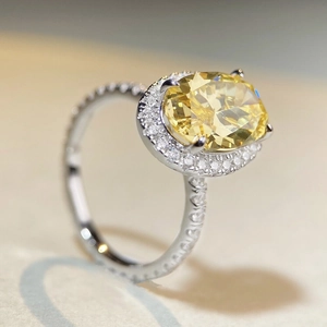 Luxury S925 silver ring featuring a large oval yellow zircon with halo diamond setting
