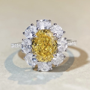 Macro detail of oval yellow carbon diamond ring with sunflower halo in S925 silver