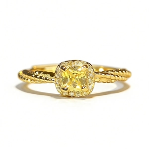Elegant sterling silver ring featuring a yellow cushion-cut stone with a halo setting