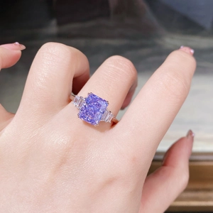 Macro shot of S925 sterling silver ring with radiant cut purple zircon and side stones