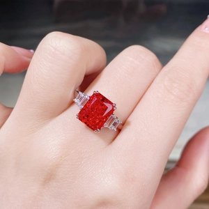 Macro shot of a S925 silver ring featuring a large red rectangular ruby centerpiece