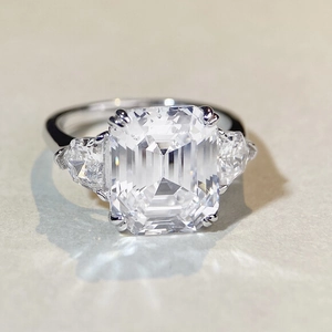 Elegant S925 silver ring featuring emerald cut high carbon diamond and side stones