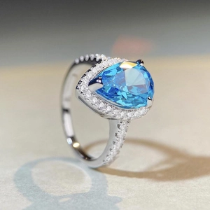 Elegant S925 sterling silver ring with pear-cut blue topaz stone and zircon halo