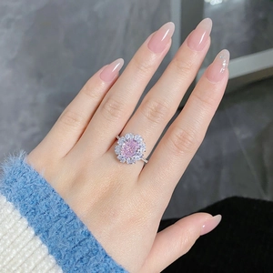 Detailed view of a S925 silver ring featuring a radiant cut pink zircon and floral halo