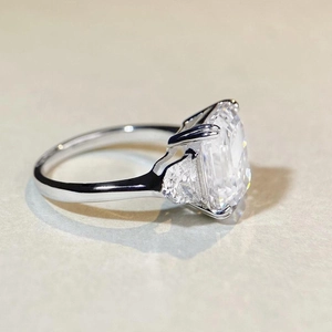 Elegant S925 silver three-stone ring with emerald-cut cubic zirconia and side stones