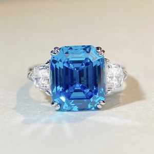 Three-stone S925 sterling silver ring with large emerald-cut blue gemstone and side stones