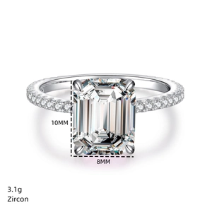 Macro view of 4 carat emerald cut zircon ring with 10x8mm stone and pave setting