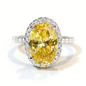 Luxurious S925 silver ring featuring a large oval yellow zircon and halo diamond setting