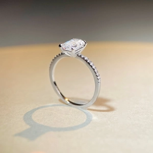 Emerald cut 1 carat moissanite ring in 925 sterling silver with pavé diamond band