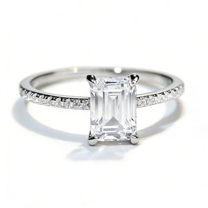 Emerald cut moissanite ring in 925 sterling silver with pavé diamond band setting