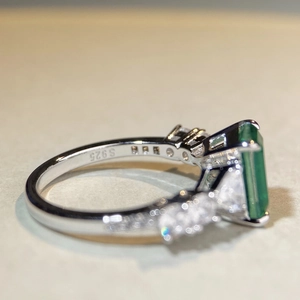 Elegant S925 sterling silver ring with emerald cut green gemstone and zircon accents