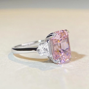 S925 silver emerald cut pink gemstone ring with triangle side stones in three-stone design