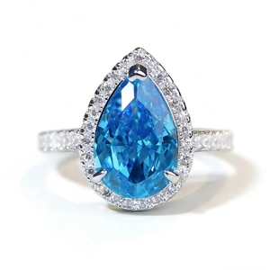 Elegant S925 sterling silver ring with pear-cut blue gemstone and halo stones