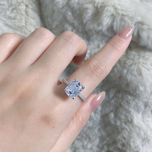 Close-up of 4ct emerald cut high carbon diamond ring in 925 silver on finger