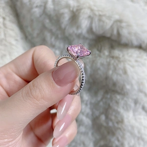 Macro detail of a luxurious S925 silver ring featuring a large radiant cut pink stone