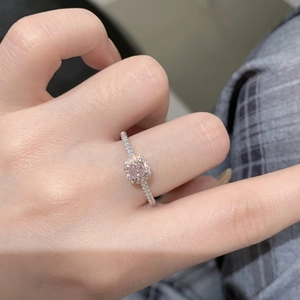 Close-up of S925 sterling silver ring featuring a pink cushion-cut halo diamond
