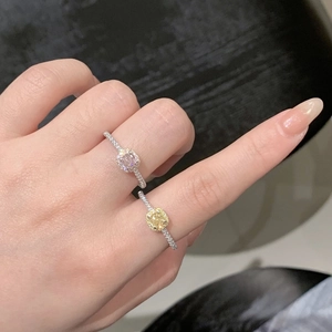 Detailed view of pink and yellow square-cut zircon rings with halo setting on S925 silver